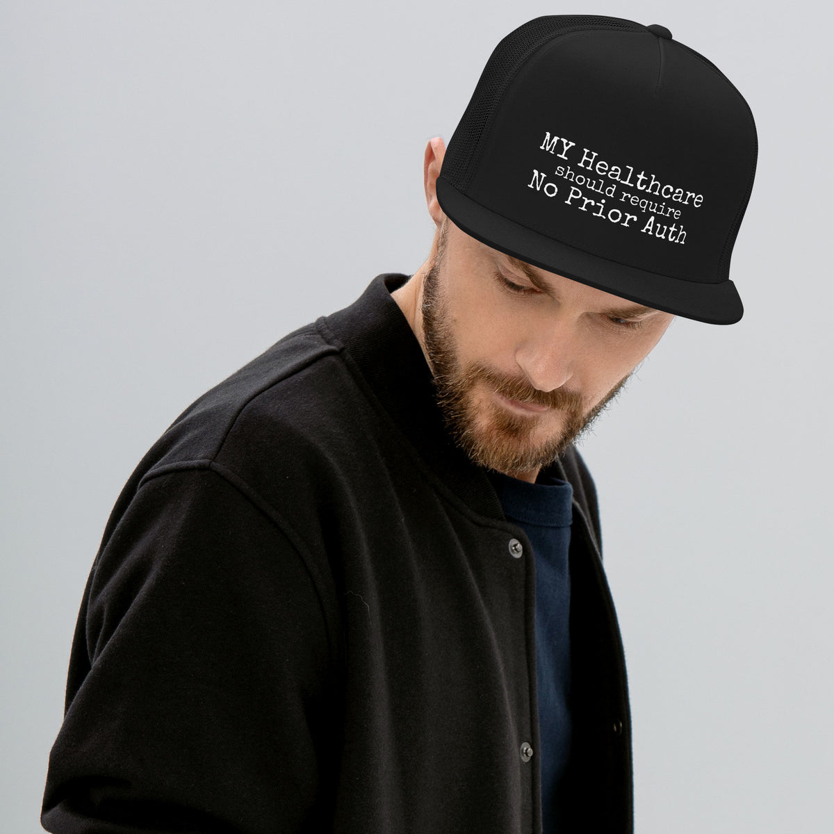THE OVERHEAD PAGE Trucker Cap in black, mesh back trucker hat, front view, physician owned