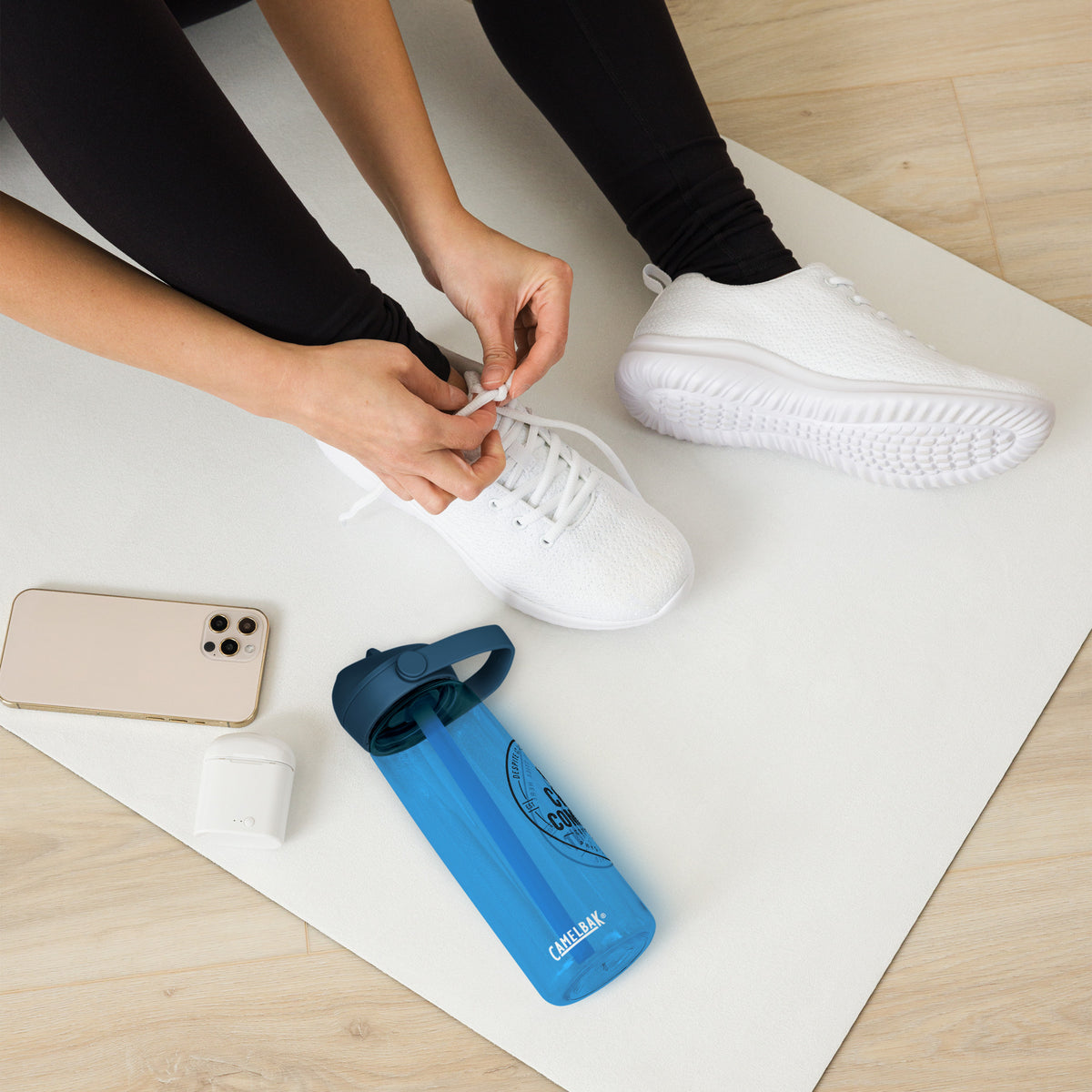 The Adequate Intake Water Bottle in oxford blue, flip straw water bottle for nurses and physicians, front view, physician owned